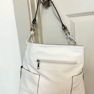 white hobo bag with lots of pockets